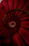 Old spiral red carpet staircase