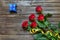 Old splintered wood background with stemmed roses