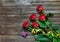 Old splintered wood background with stemmed roses