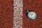 Old sport stopwatch on running track rubber