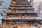 Old stairs in park covered with yellow maple leaves. Autumn concept