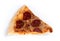 Old stale pizza slice isolated against white