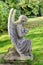 Old statue of angel at a cemetery on Loch Leven shore in Scotland, UK