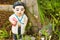 Old statue baby doll welcome to thailand in garden