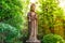 Old statue stone goddess of Mercy known as Quan Yin or Guan Yin