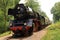 Old steam engine locomotive on track