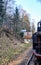 Old steam locomotive drives past a railway house with solar panels on the roof. Dynamics through motion blur