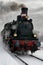 Old steam locomotive in the snow