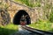 Old steam train leaves the tunnel on Circum-Baikal Railway