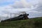 Old steam train from the SSN organization in Rotterdam running at the railroad track in Nieuwerkerk aan den IJssel