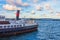 Old steamboat with a pipe at the pier in the northern seas