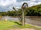 Old steel cargo winch on harbour by tidal River Tamar in Devon