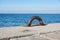 Old steel mooring bollard pole on a pier, rusty mooring .