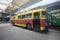 An old but still in use trolleybuses parked on the inspection pit at the trolley depot. Hangar of depot maintenance