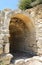 Old stone arch in underground entrace