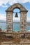 Old stone archway and bell. Nafplio, Peloponnese, Greece,