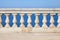 Old stone balustrade with blue sea and sky