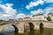 Old stone bridge across the Mayenne River in Laval, France