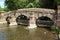 Old stone bridge and cattle fence on river in Kent, England