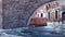 Old stone bridge over water canal in Venice, Italy