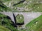 Old stone bridges over alpine streams on the alpine mountain St. Gotthard Pass Gotthardpass, Airolo - Canton of Ticino Tessin