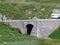 Old stone bridges over alpine streams on the alpine mountain St. Gotthard Pass Gotthardpass, Airolo - Canton of Ticino Tessin