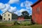 Old Stone Building with Two Red Barn Buildings