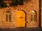 Old stone building with yellow door and windows