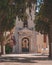 an old stone church with a clock tower and iron doors