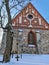 Old stone Church of St. Lawrence in daylight on a frozen January day