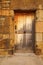 Old stone doorway with ancient weathered wooden door