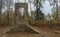 Old Stone Entrance Of A Swinging Bridge.