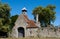 Old stone gatehouse with Tudor Clock Tower at the entrance to Beaulieu Abbey in the New Forest in the south of England