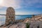 Old stone mooring post in l`Escala, costa brava, Spain.