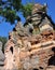 Old stone pagoda made of bricks with green plants growing out of it at Inle Lake, Myanmar