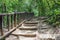 Old Stone staircase with wood railing in jungle, Thailand