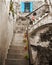 Old stone stairs and blue window