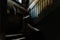 Old stone stairs in the dark atrium of a disused building in the old part of Bari, Italy