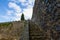 Old stone stairs, medieval wall, castle, sky