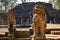 Old stone statue of the sacred beast of a lion in sunset light. Khmer lion guardians statue of Angkor Wat temple complex in Siem