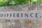 Old stone texture of Difference with a dot word on wall brick