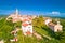 Old stone town of Buje on green hill panoramic view