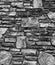 Old stone wall background cobblestones black and white