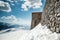 Old stone wall fortress castle on top of a snow mountain