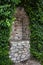 Old Stone Wall Niche With Creeping Plants