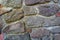 Old stone wall, structure. old broken stones, cement joints close-up. crumble with age. construction, repair. concept of