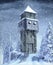 Old stone watch medieval watch tower in a snow covered winter landscape