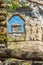 An old stone window archway in the stonework a Bancroft Castle