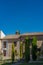 Old stoned house in Baeza city, with trees infront