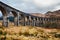 Old stony Glenfinnan train viaduct in a scottish autumn